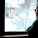 Woman in Old Age Stands at the Window and Looks Alone Into the Distance - VideoHive Item for Sale