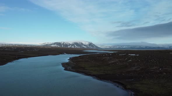 Flying Over the River with Glaciers in the Background