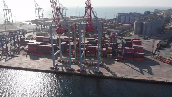 Long Shadows From Giant Cranes in Sea Port Cargo Container Terminal