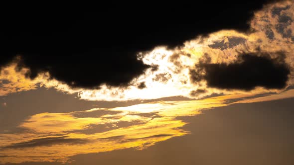 Time Lapse Bright Orange Sunset Sun Sets Behind the Clouds