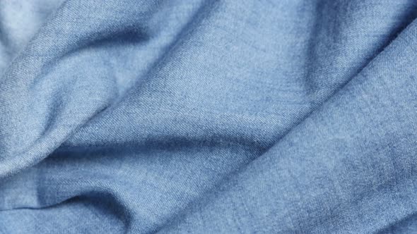 Blue high quality denim details and texture  close-up tilting 4K 2160p 30fps UltraHD video - Dugaree