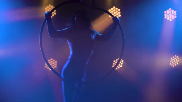 An Acrobatic Show on an Air Hoop Performed By a Young Attractive Circus Artist. Performing