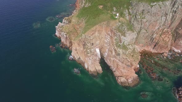 View From a Drone of the Coastline with a Rocky Coast Island of Shkot