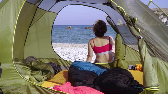 Woman in a Swimsuit Resting at a Camping on a Sandy Beach