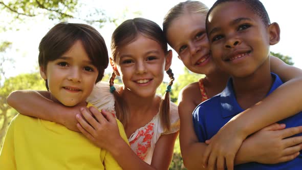 Group of kids standing together with arms around