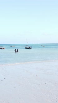 Boat Boats in the Ocean Near the Coast of Zanzibar Tanzania Slow Motion Vertical Video