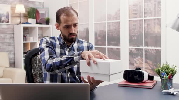 Famous Influencer Opening a Box with New Smartphone