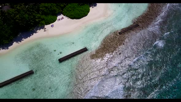 Aerial drone nature of beautiful resort beach lifestyle by blue sea and white sandy background of a 