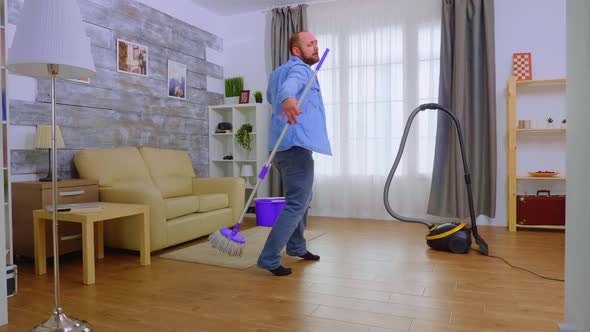 Funny Man Dancing with the Mop