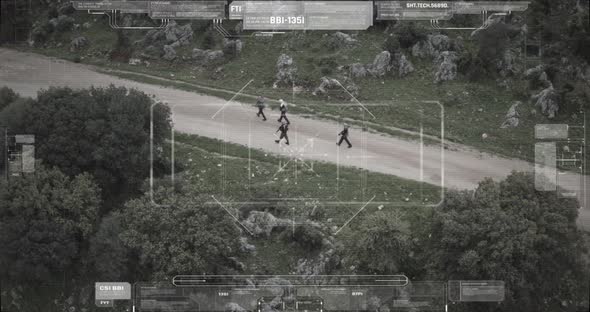 Surveillance drone camera view of terrorist squad walking with weapons