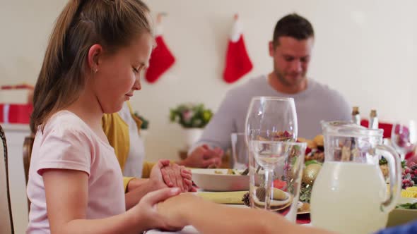 Caucasian family having christmas dinner