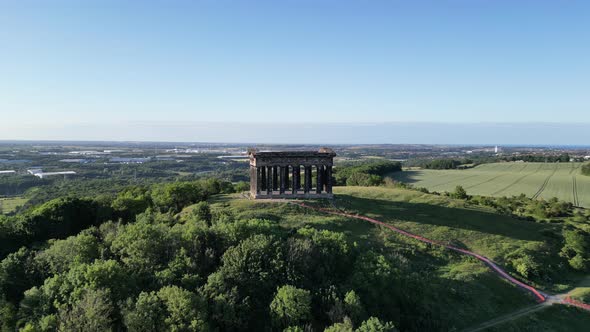 Aerial wide cinematic, camera pulls back and rises up on Penshaw Monument in Sunderland, North East,