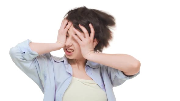 Young Caucasian Brunette Girl with Short Hair Actively Shaking Her Head