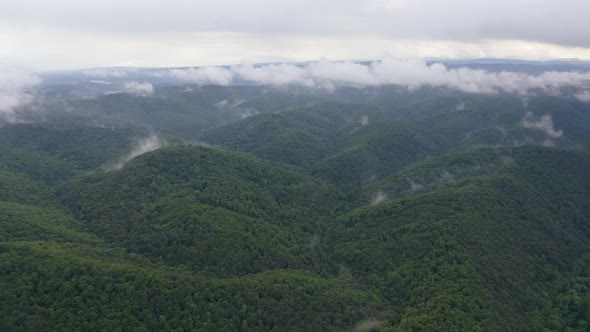 Drone flight over green mountain slopes