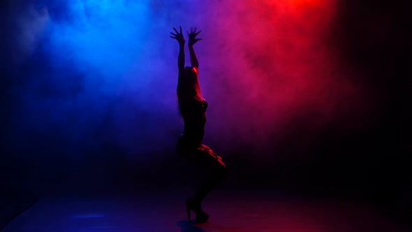 Sexy of Go-go Dancer Performing on Stage in Bright Lights