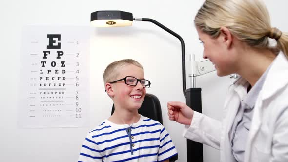 Optometrist giving high five to young patient