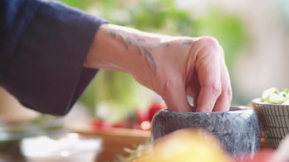 Hands of Male Cook Adding Salt into Bowl and Stirring with Whisk