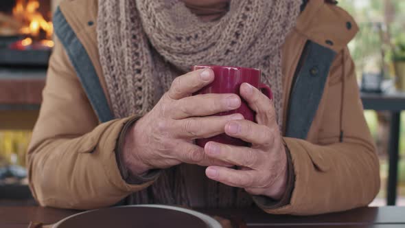 Unrecognizable Aged Man Holding Tea Cup