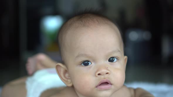 Happy portrait baby boy playing alone