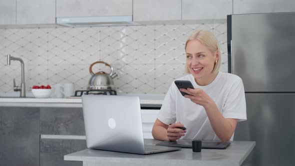 Blonde Woman Freelancer Records Voice Message or Uses Virtual Assistant at Home