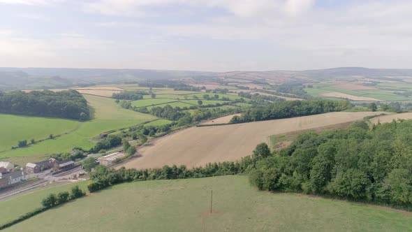 Wide shot aerial of Washford and the surrounding countryside area of Somerset.