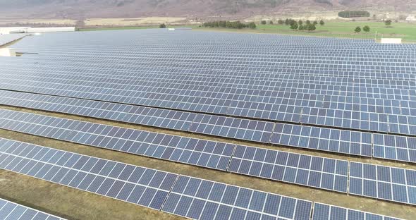 4K Aerial footage of photovoltaic solar farm. Solar farm power station from above.