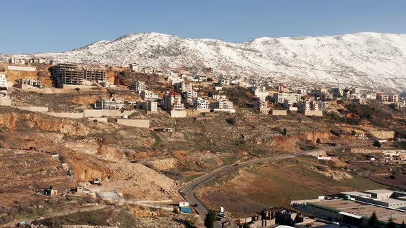 Hermon mountain ridge covered with snow during 2022 winter, with the town houses of Majd al Shams.