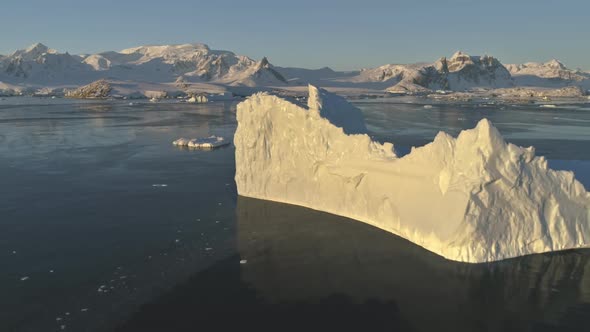 Drone Flight Over Sunlit Iceberg. Antarctica.