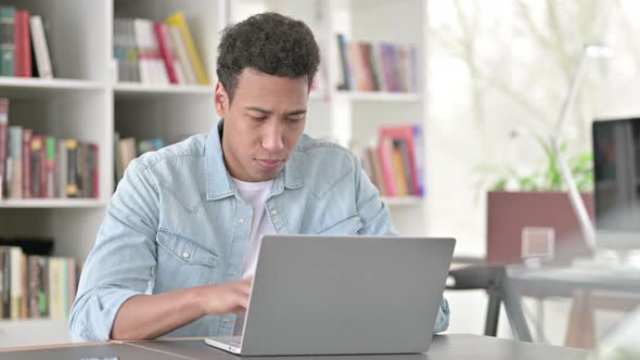 Young African American Man Standing Up And, Leaving Workstation 