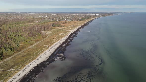 Drone footage of coastline near danish suburbian area close to Copenhagen