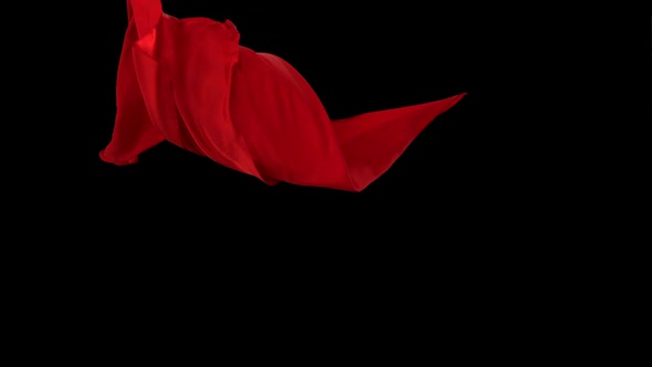 Red fabric flowing on black background, Slow Motion