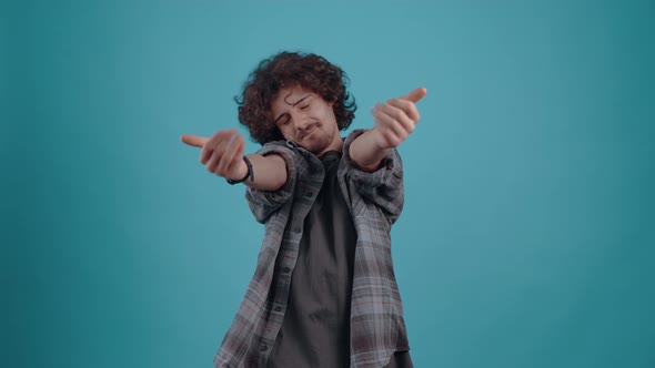 Cute and Excited Young Hipster with His Hands He Wants to Hug Smiling