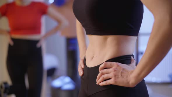 Closeup Belly of Slim Young Caucasian Woman Breathing in and Out Training Muscles with Blurred