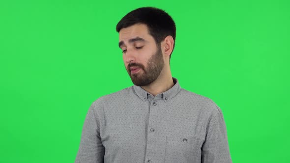 Portrait of Brunette Guy in Anticipation of Worries, Then Disappointed and Upset. Green Screen