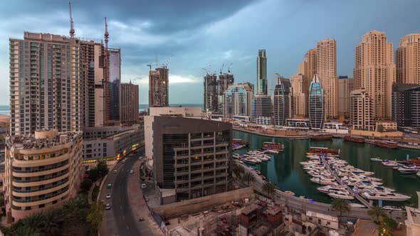 Luxury Yachts Parked on the Pier in Dubai Marina Bay with City Aerial View Timelapse