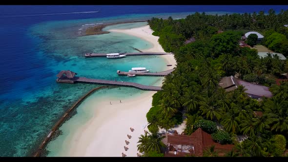Aerial scenery of perfect tourist beach lifestyle by shallow sea and white sand background of a dayo