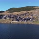 Aerial drone view of a beautiful glacier lake and village on a sunny day - VideoHive Item for Sale