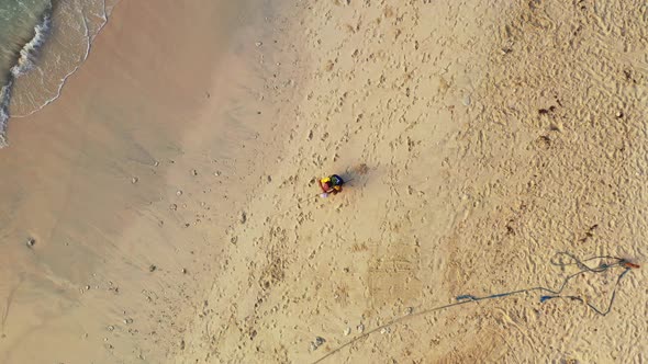 Angling for cute guy on a journey spends quality time at beach on paradise white sand and blue backg