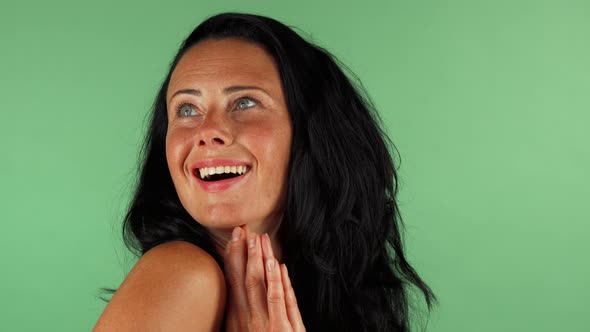 Happy Mature Woman Looking Surprised on Green Chromakey
