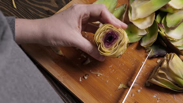 Woman Cut Artichoke