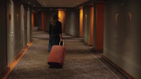  - Hotel Guest with Trolley Case Walking To the Room