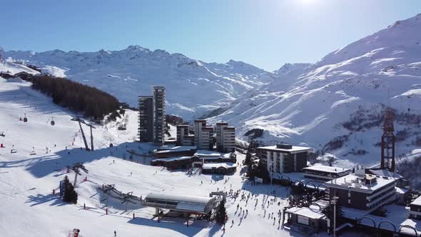 Majestic Winter Aerial Landscape and Ski Resort with Typical Alpine Wooden Houses in French Alps