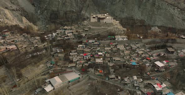 Aerial Flying Over Remote Hillside Village In Hunza Valley In Pakistan. Circle Dolly