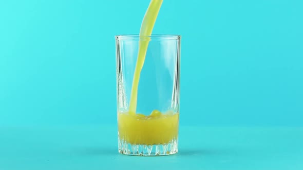 Slow Motion Close-up Shot of Fruit Orange Multifruit Juice Cold Beverage Drink