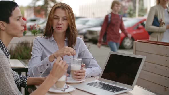 Female Colleagues in the Outdoor Cafe