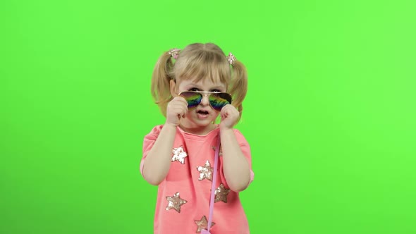 Positive Girl in Pink Blouse and Sunglasses Dancing and Posing. Chroma Key