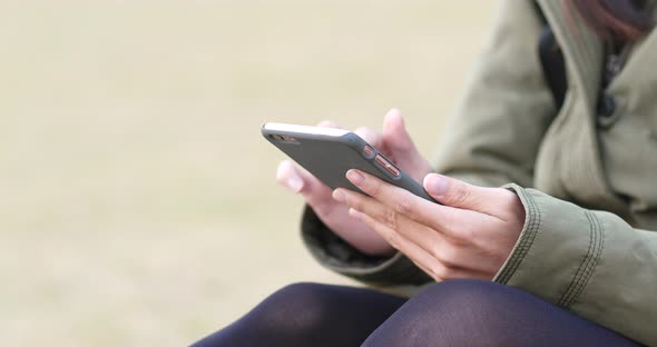 Woman use of mobile phone at outdoor