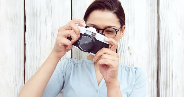 Photographer taking photo with vintage camera