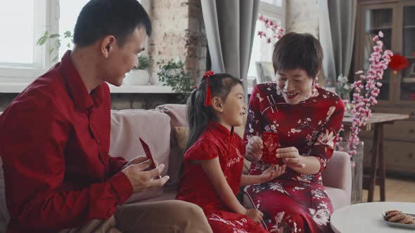 Happy Asian Family Celebrating Chinese New Year