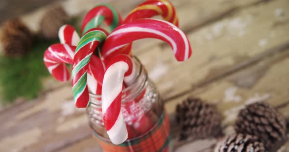 Candy canes arranged in a jar 4k